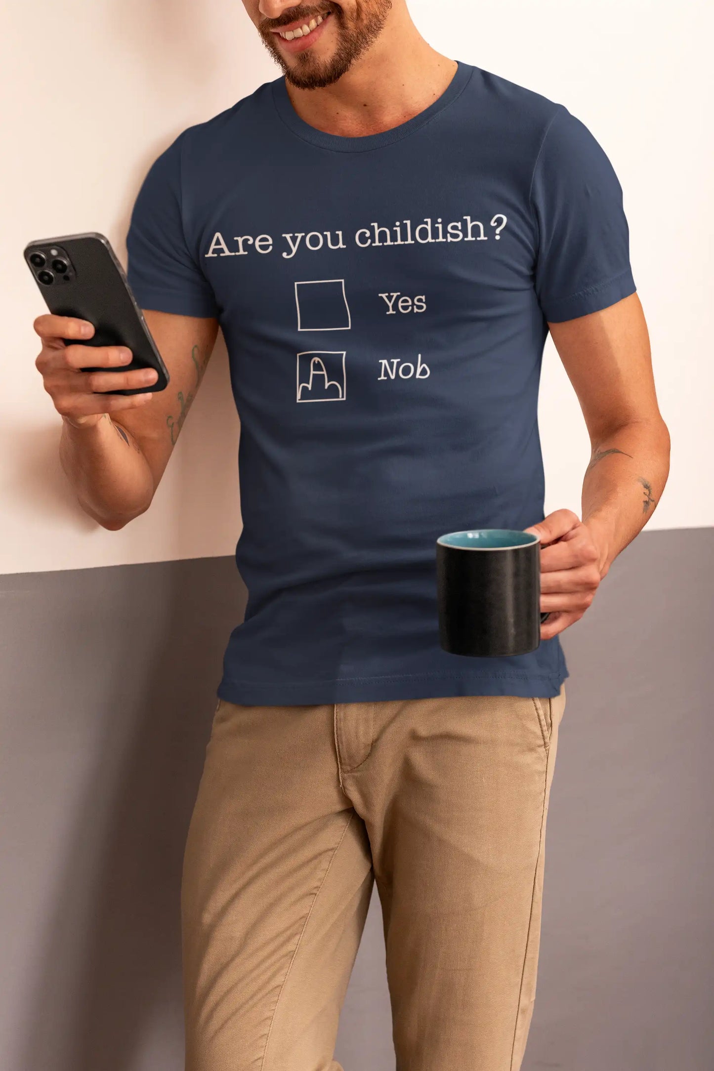 Man wearing Telleath Print “Are You Childish?” T-shirt in navy blue