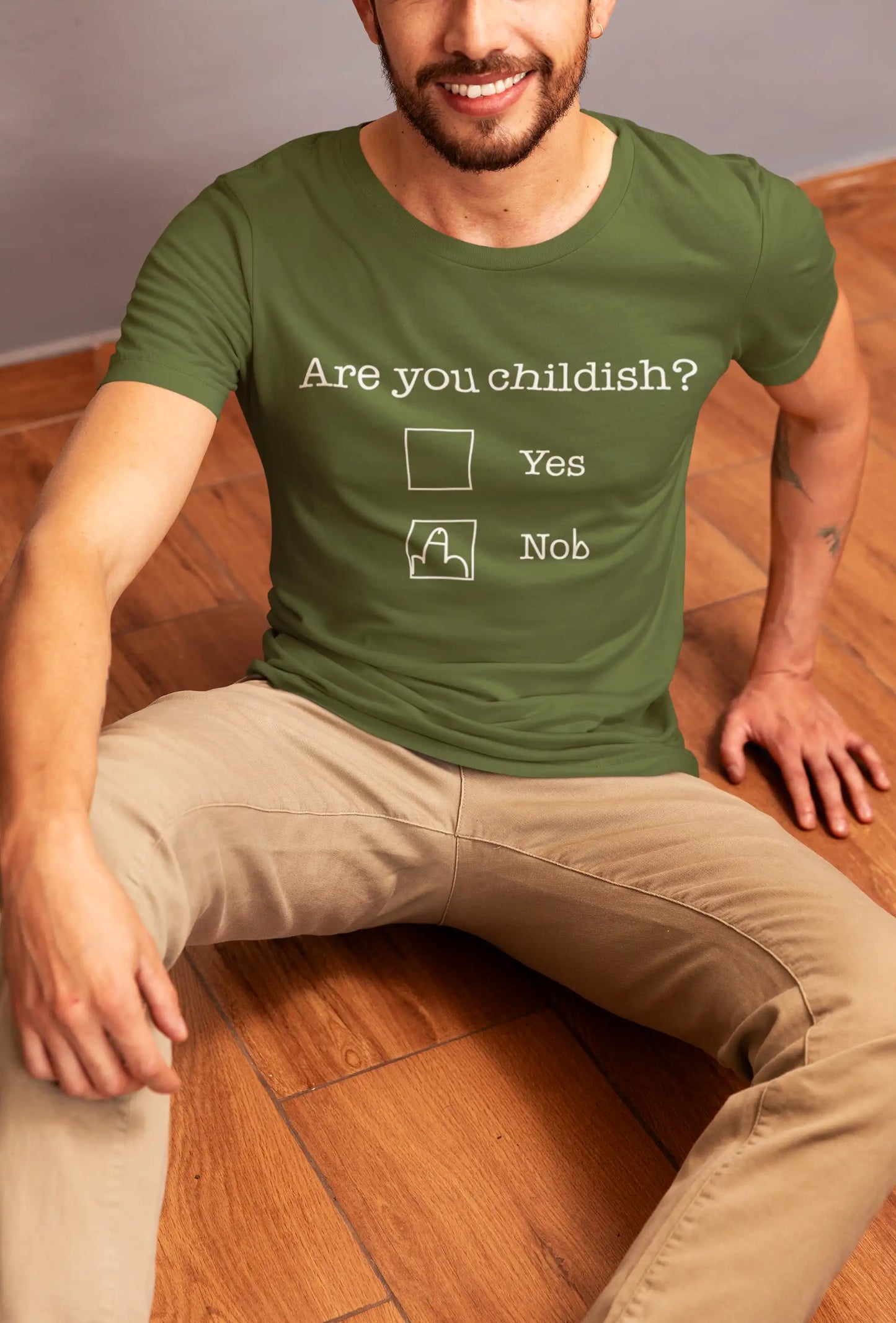 Man wearing Telleath Print “Are You Childish?” T-shirt in military green